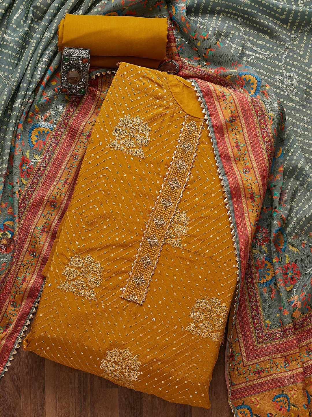 

Koskii Women Orange Embroidered Art Silk Unstitched Dress Material