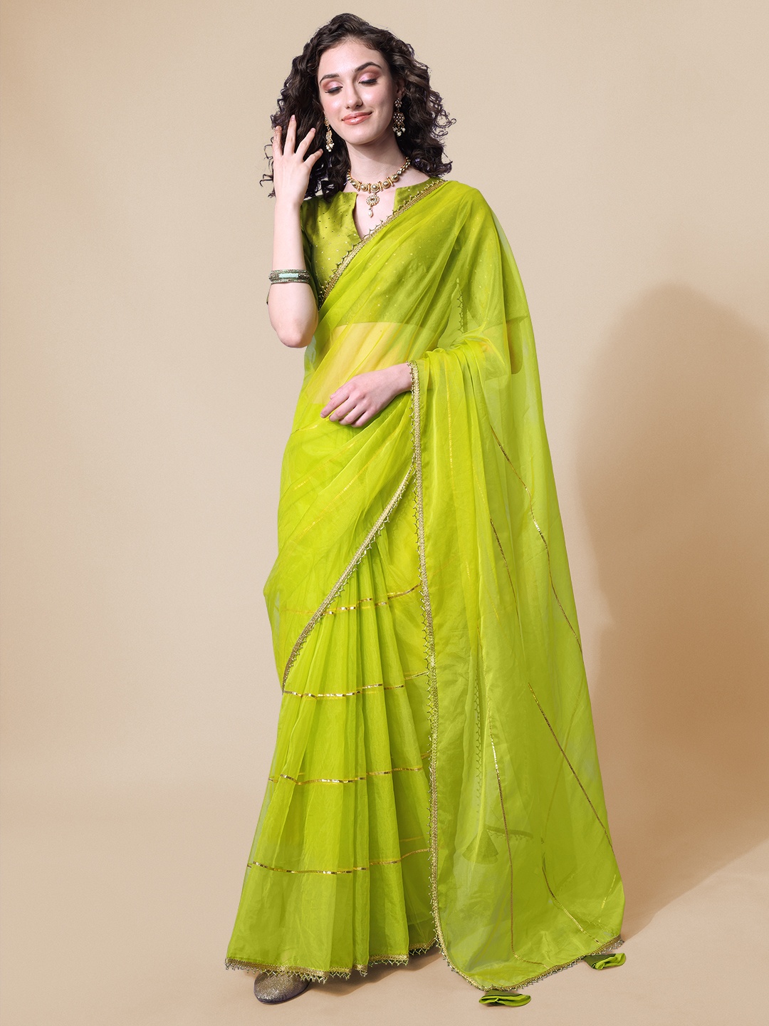 

Sangria Green Solid Gotta Detailing Saree