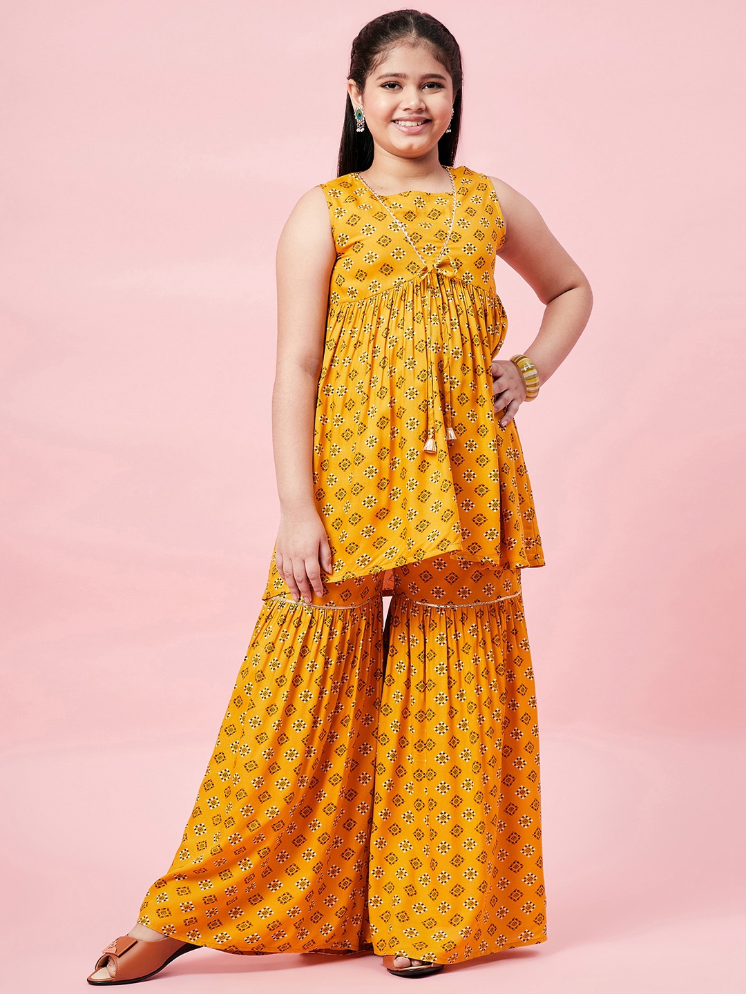 

Stylo Bug Girls Mustard Yellow Ethnic Motifs Printed Empire Pure Cotton Kurta with Sharara