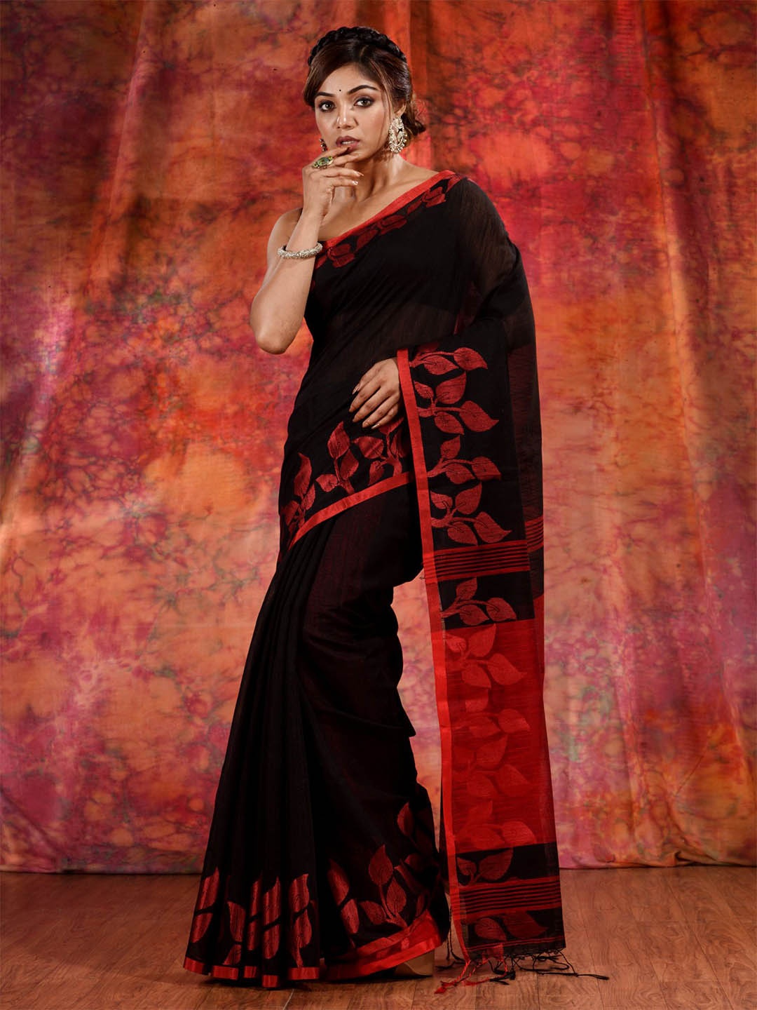 

Charukriti Black & Orange Woven Design Saree