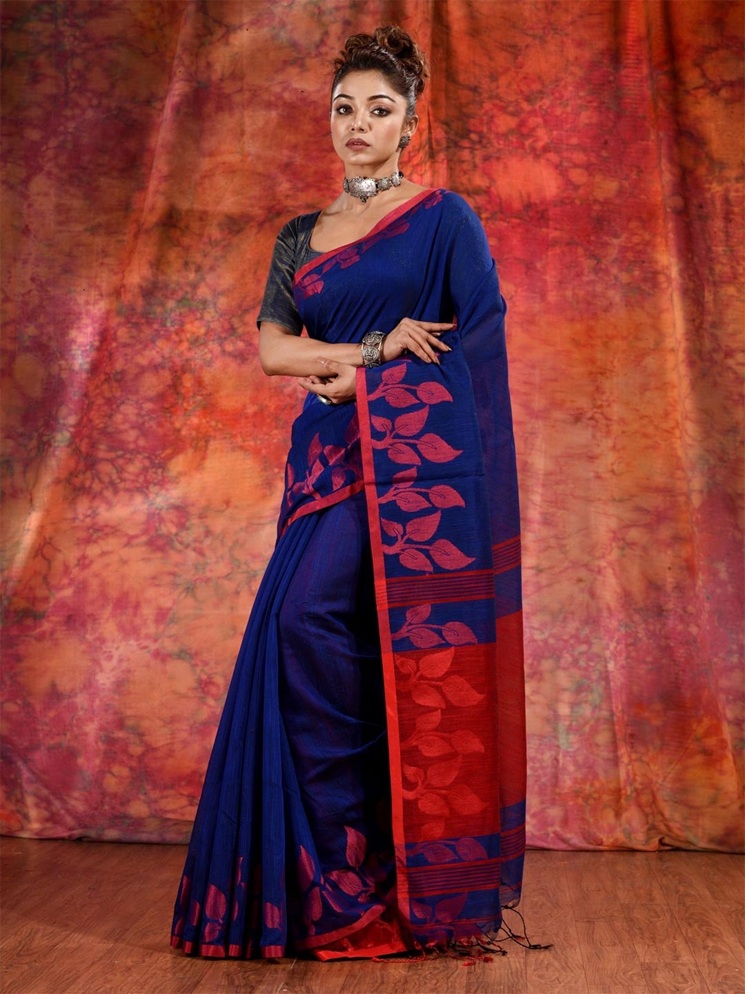 

Charukriti Blue & Red Woven Design Saree
