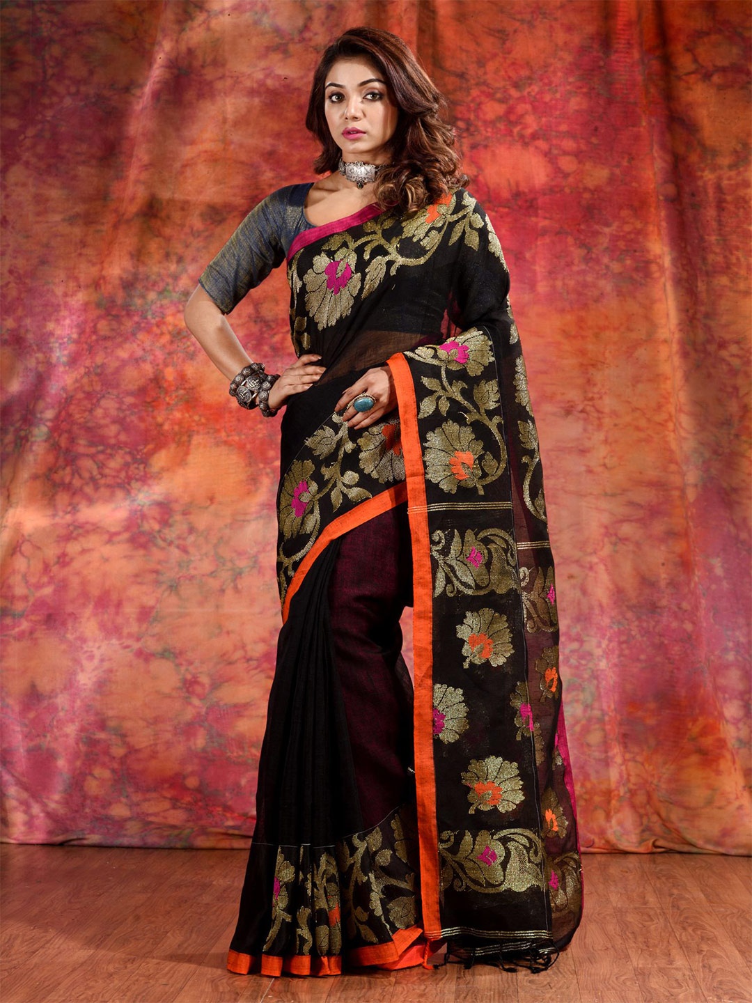 

Charukriti Black & Orange Woven Design Zari Pure Linen Saree