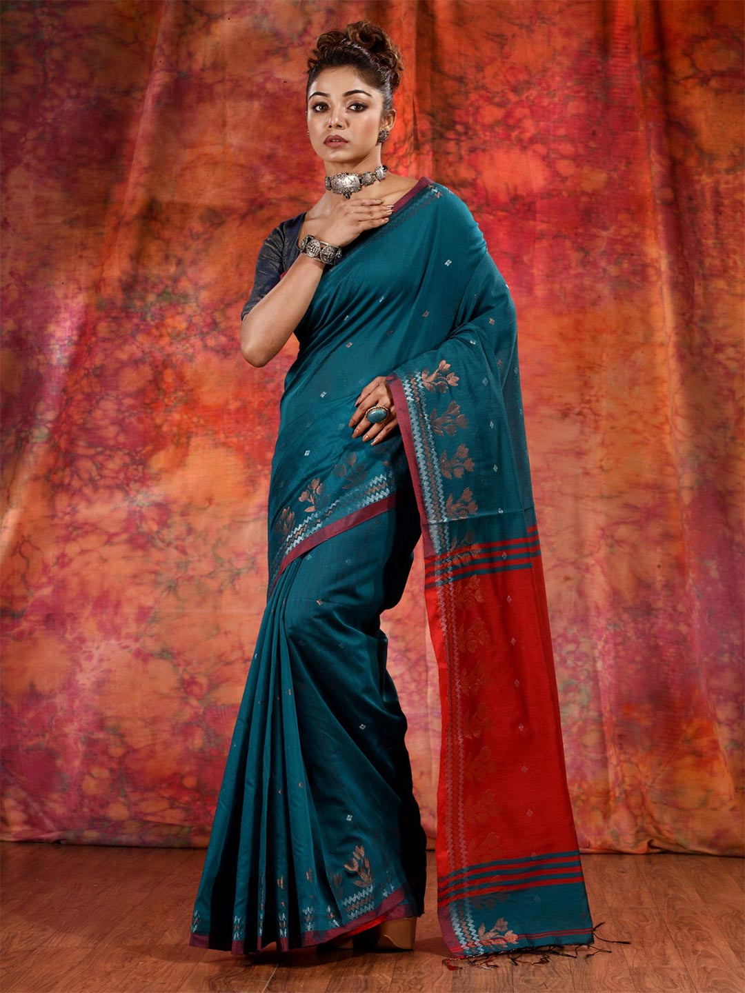

Charukriti Teal & Red Woven Design Pure Cotton Saree