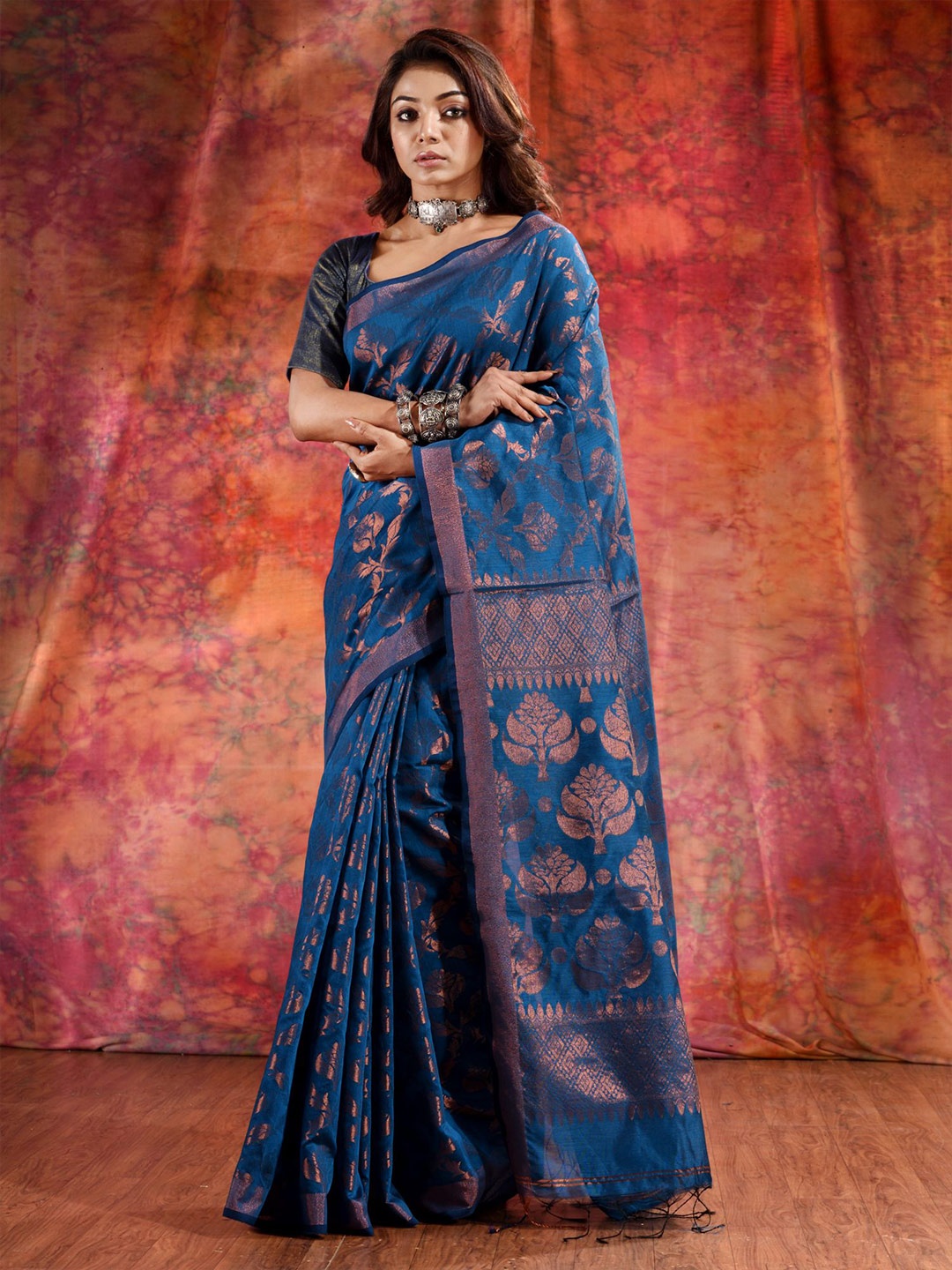 

Charukriti Women Blue & Copper-Toned Ethnic Motifs Zari Cotton Blend Saree