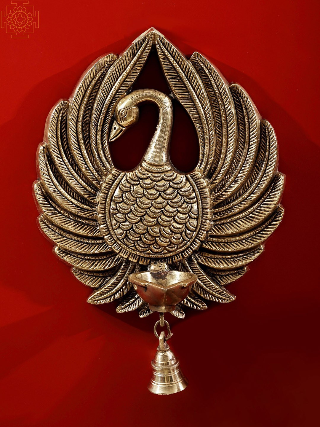 

Exotic India Gold-Toned Peacock Wall Hanging Diya With Bell