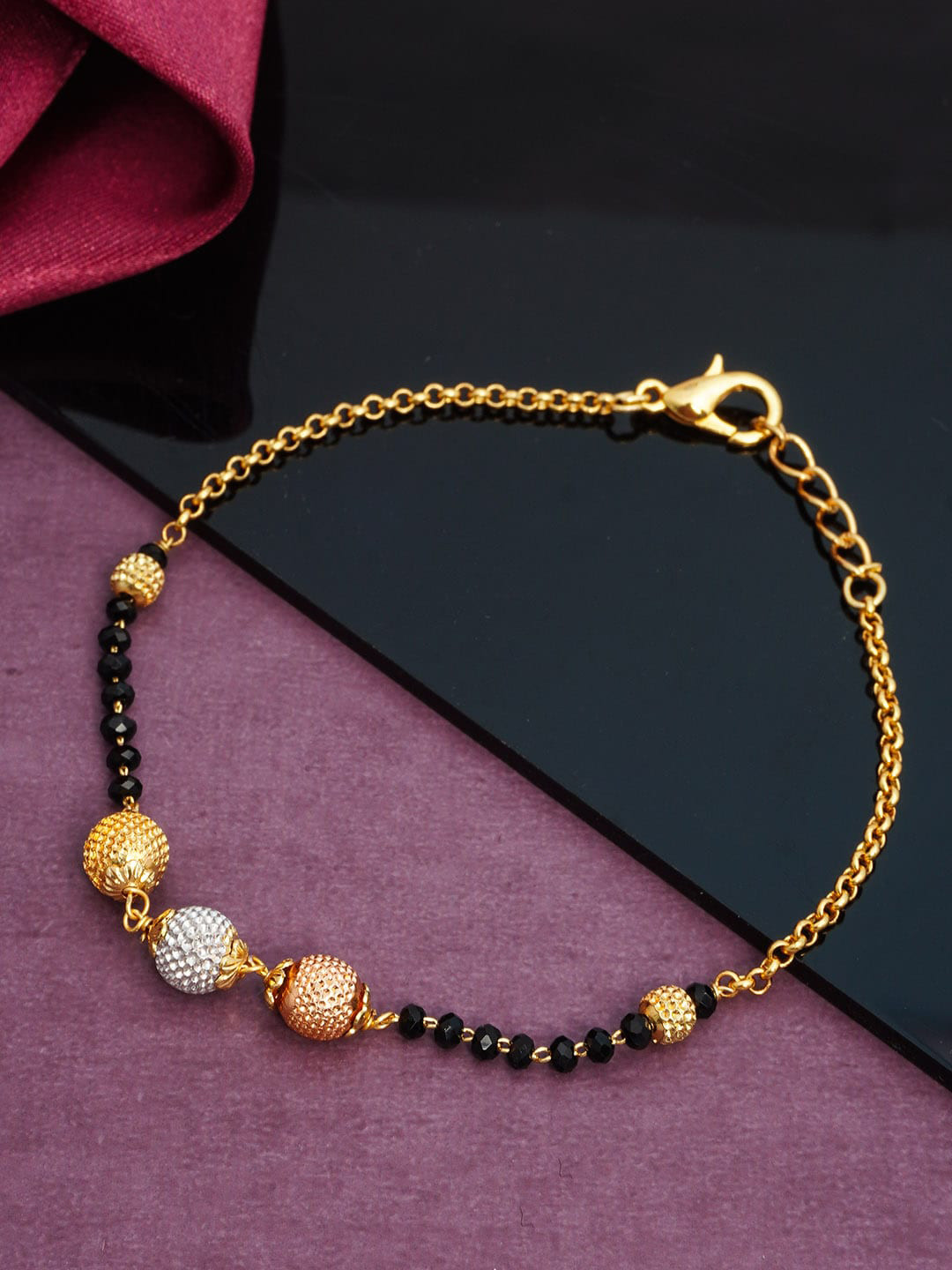 

Urmika Women Gold-Toned & Silver-Toned Charm Bracelet