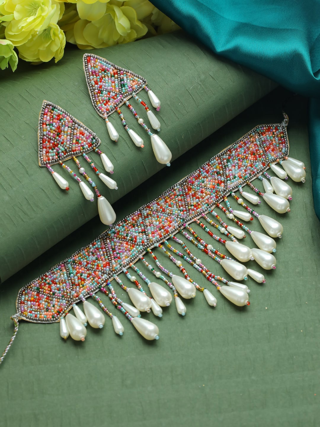 

Jazz and Sizzle White Pearl-Studded & Beaded Tasselled Choker Handcrafted Jewellery Set