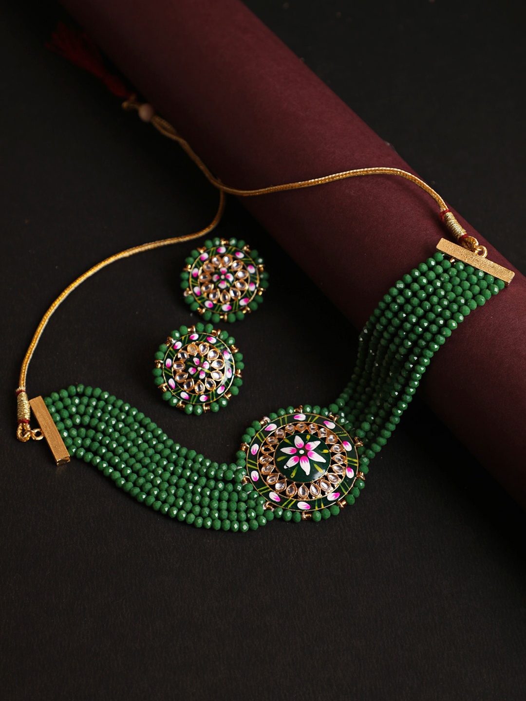 

Jazz and Sizzle Gold-Plated Green Kundan-Studded & Beaded Jewellery Set