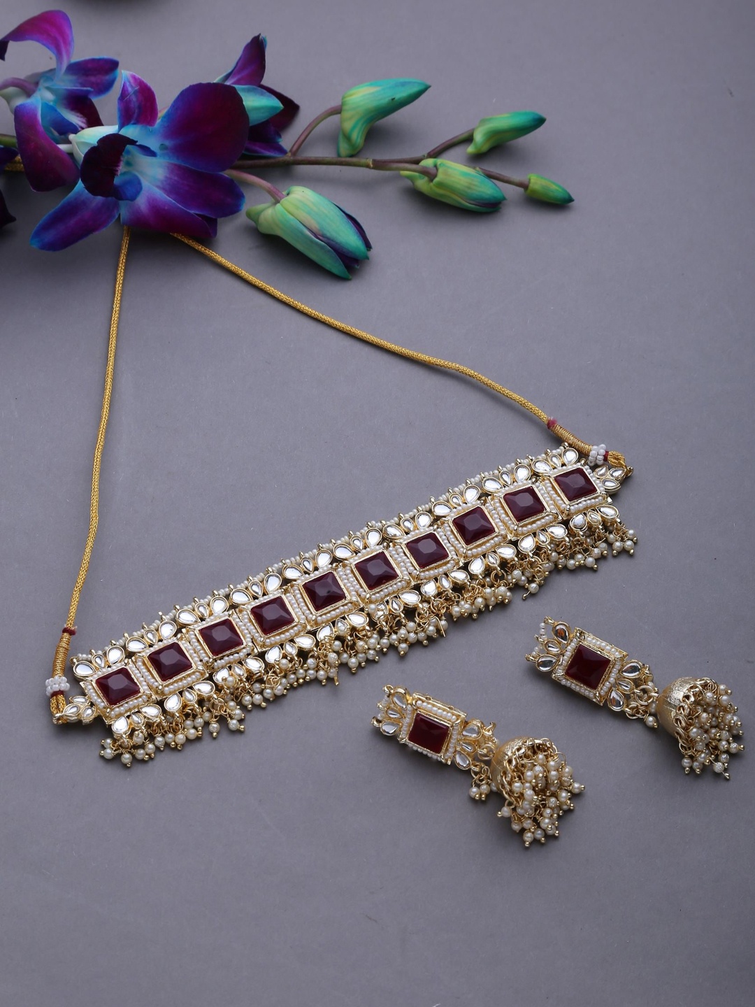 

Jazz and Sizzle Gold-Plated Maroon Kundan Studded Jewellery Set