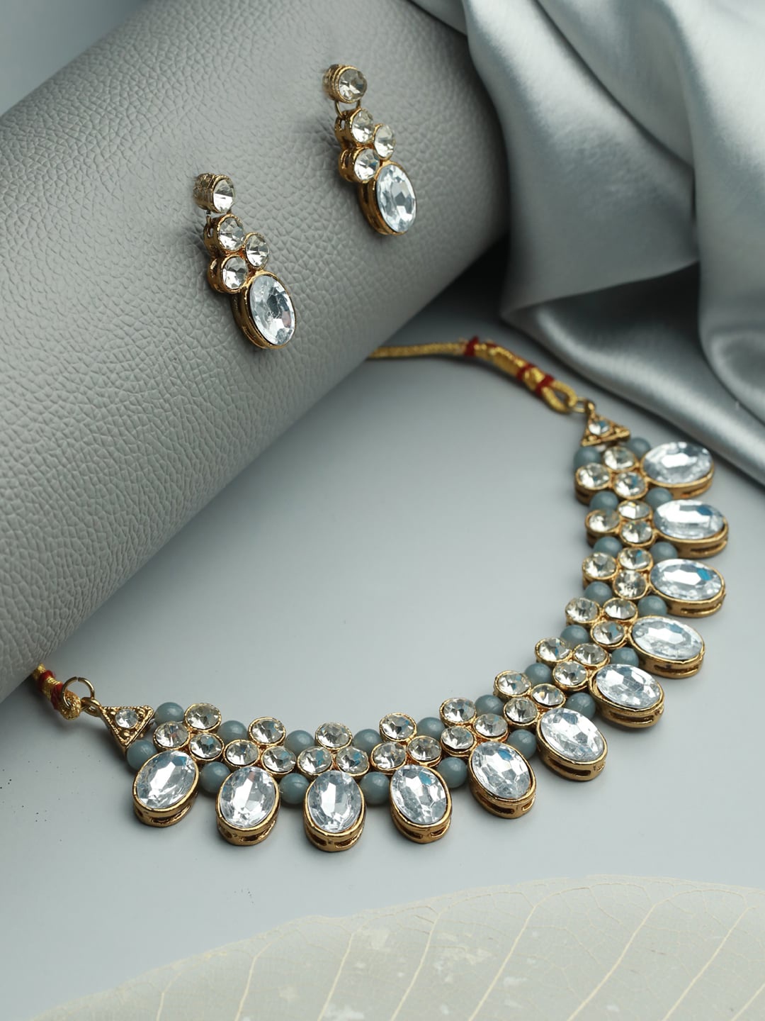 

Jazz and Sizzle Gold-Plated Grey & White Crystals Studded & Beaded Jewellery Set