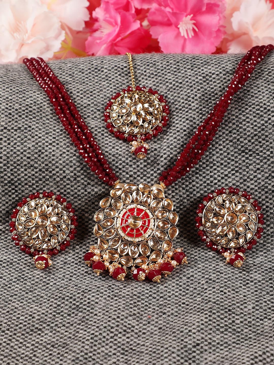 

Jazz and Sizzle Gold-Plated Maroon Red Kundan-Studded & Beaded Jewellery Set