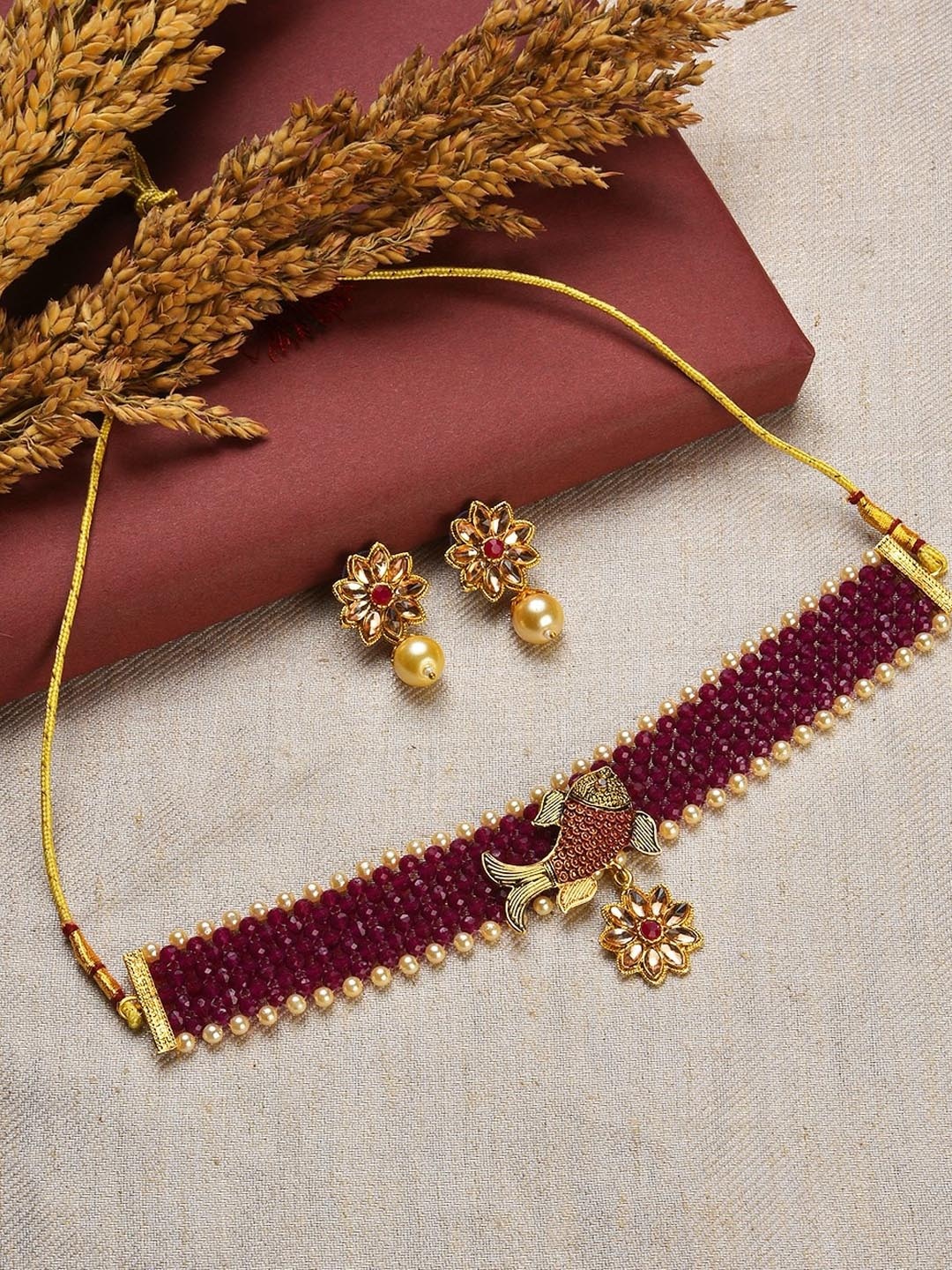 

Jazz and Sizzle Gold-Plated Maroon Stone-Studded & Pearl Beaded Jewellery Set