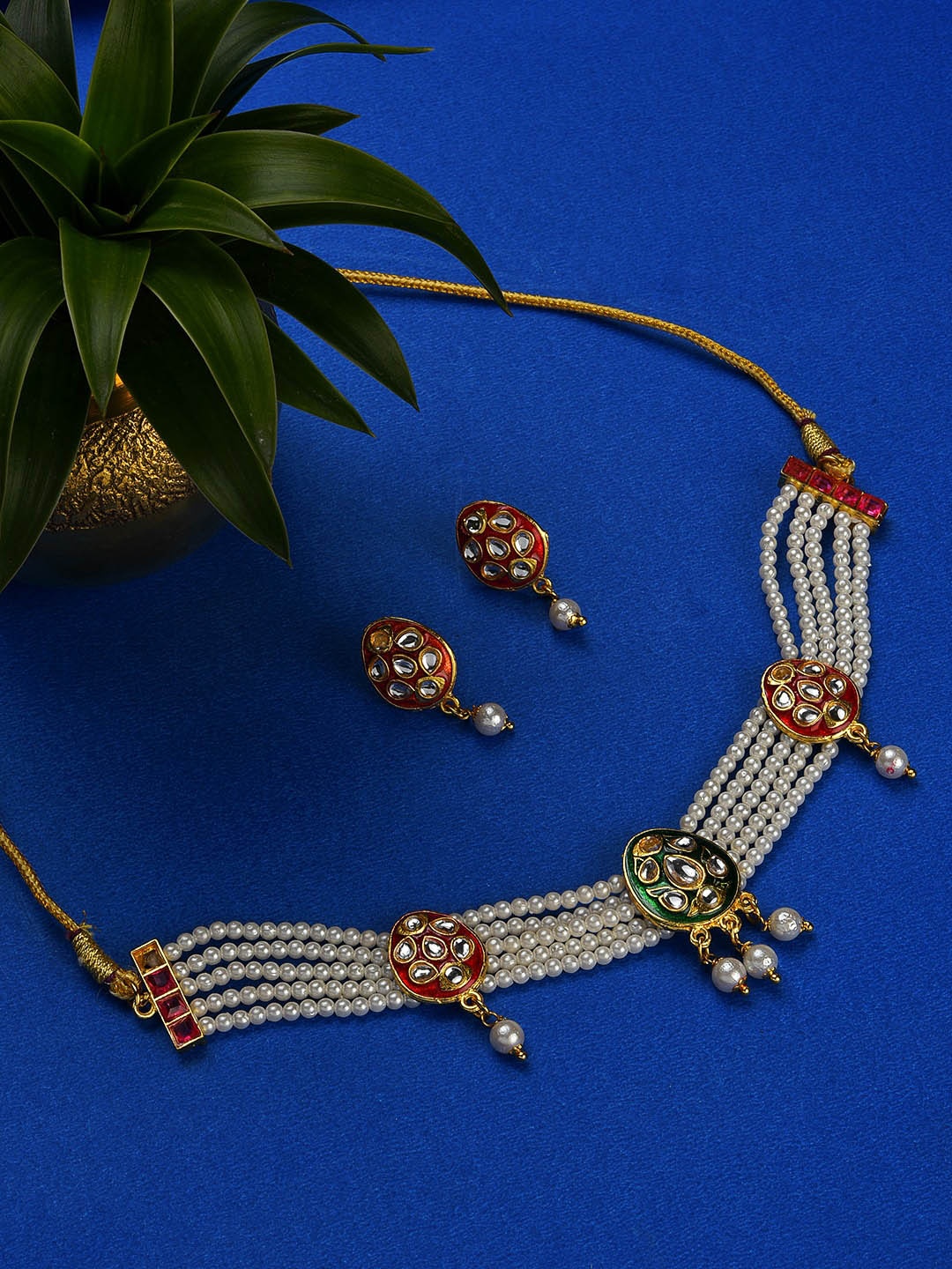 

Jazz and Sizzle Gold-Plated White & Red Kundan Studded Jewellery Set