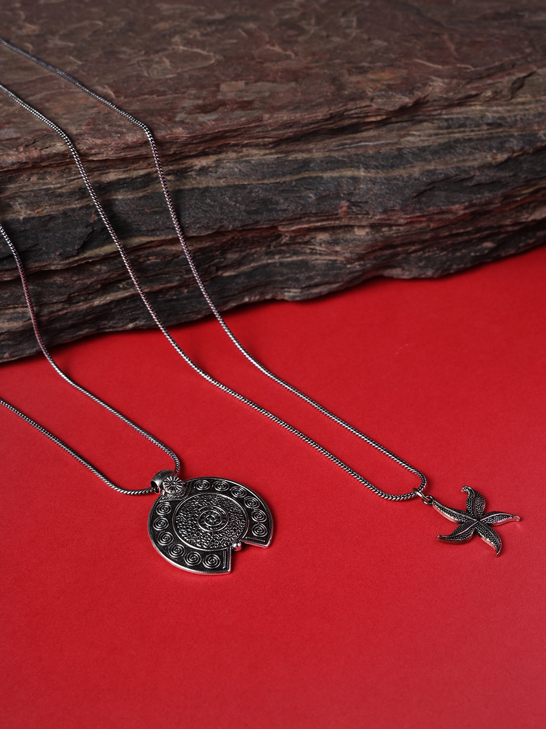 

Jazz and Sizzle Set of 2 Star & Geometrical shape Silver Plated Oxidised Textured Necklace