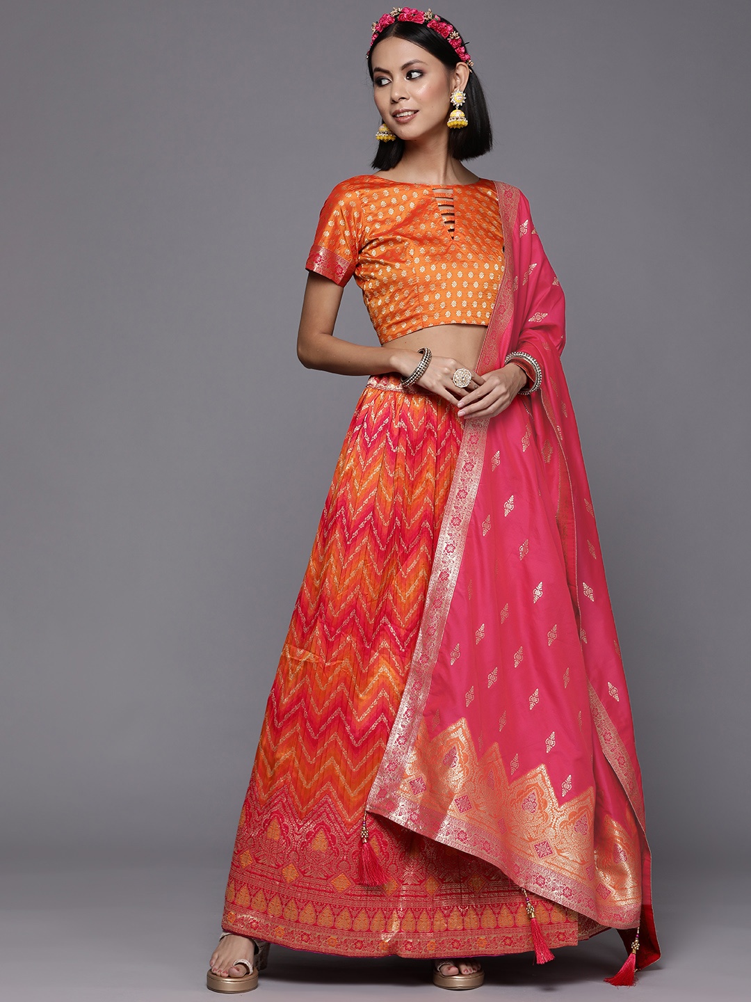 

Mitera Mustard Yellow & Pink Semi-Stitched Lehenga & Unstitched Blouse With Dupatta