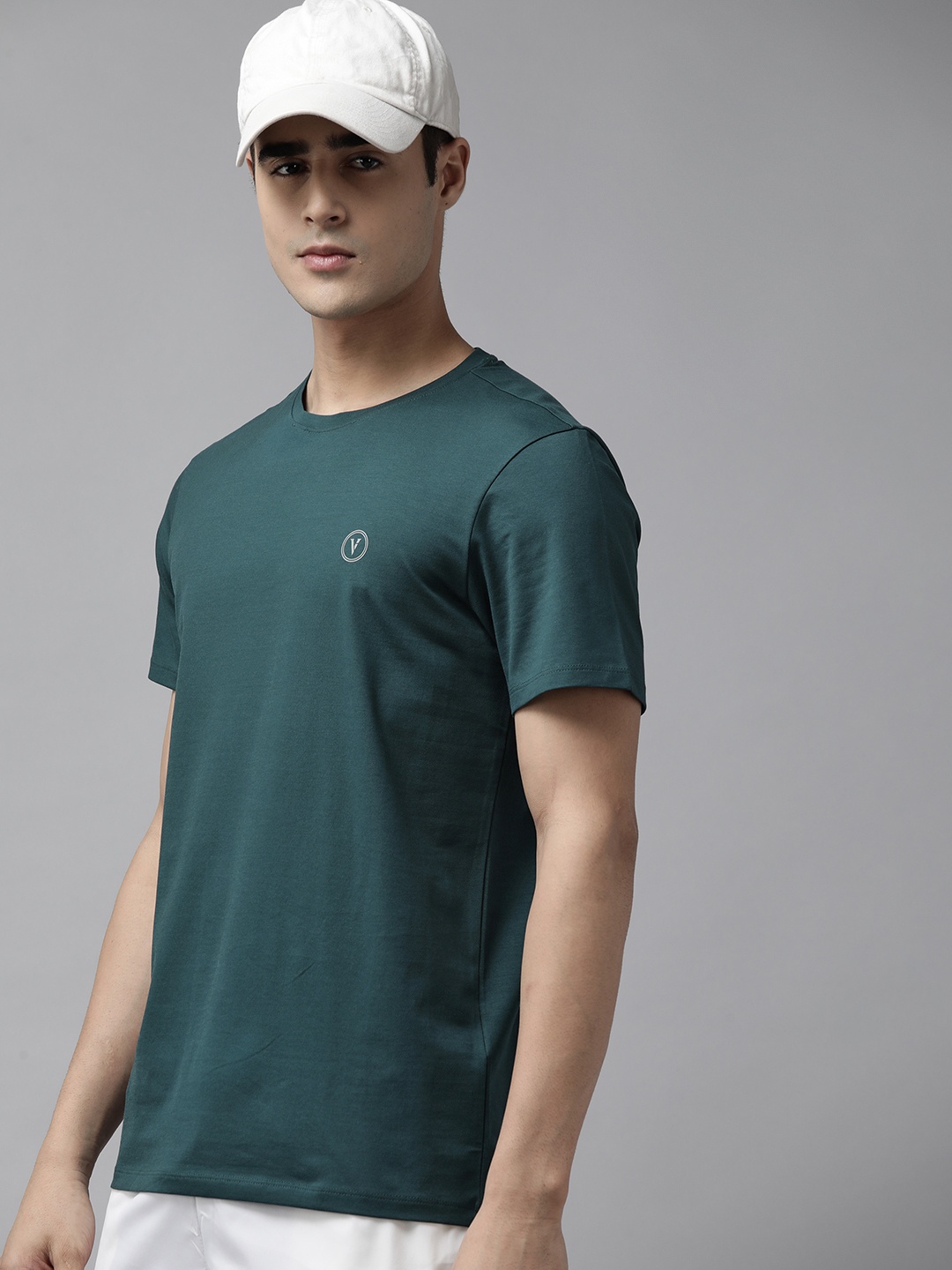 

Van Heusen Flex Men Teal Blue Solid Active Fit Sports T-shirt
