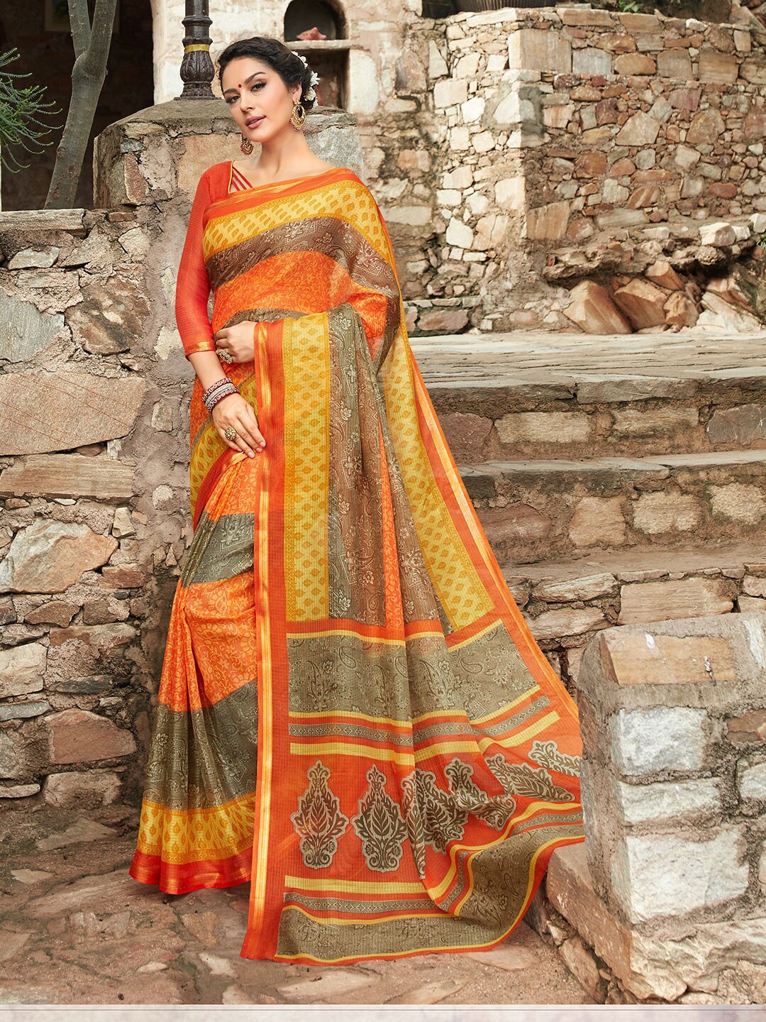 

Shaily Orange & Red Ethnic Motifs Zari Silk Cotton Saree