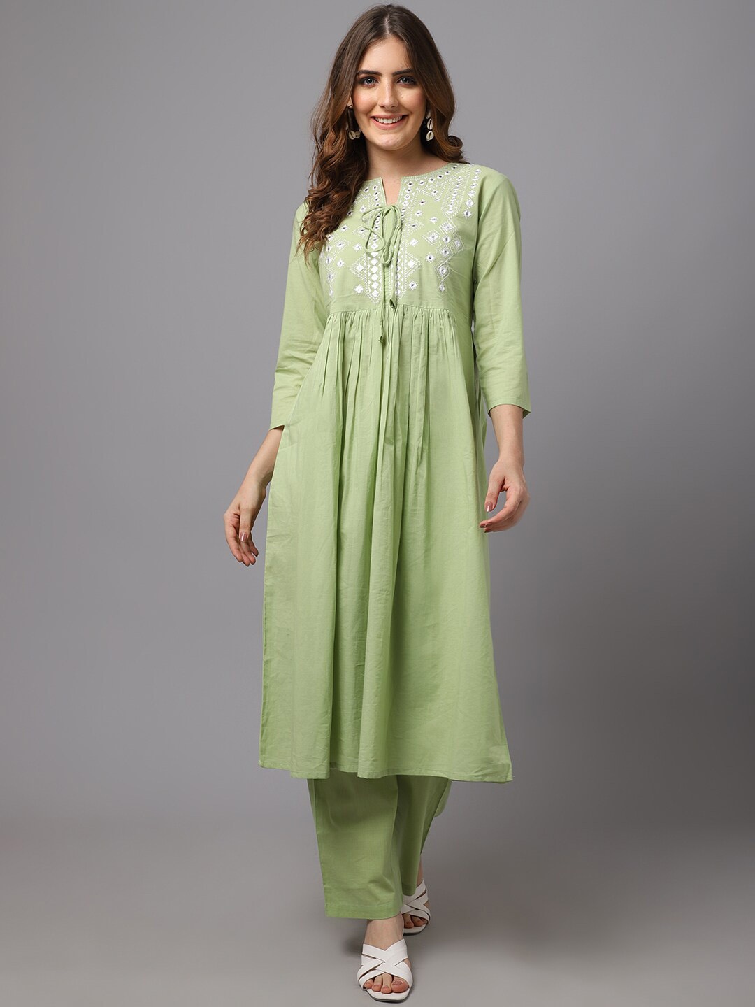 

Tulsattva Women Lime Green Floral Embroidered Pleated Pure Cotton Kurti with Trouser