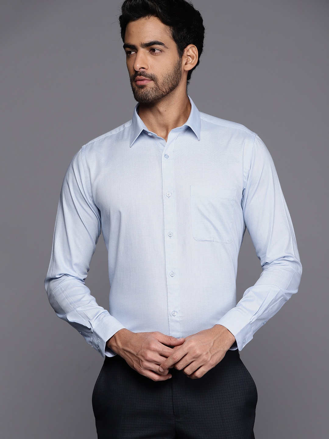 

Raymond Men Blue Pure Cotton Solid Slim Fit Formal Shirt