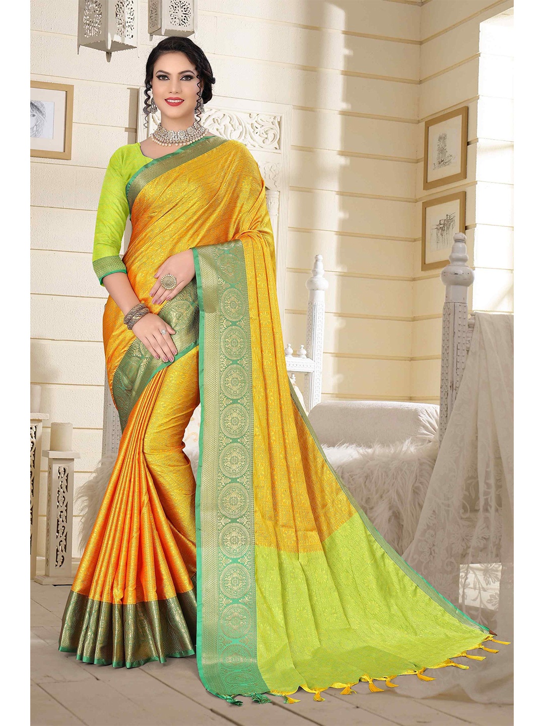 

Mizzific Green & Mustard Ethnic Motifs Zari Silk Cotton Kanjeevaram Saree
