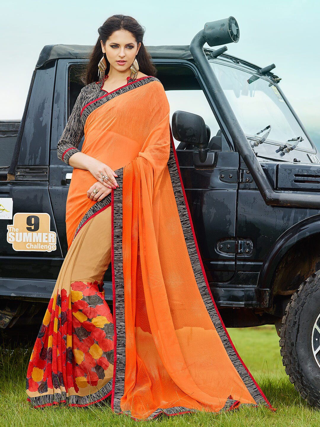 

Shaily Orange & Black Floral Pure Georgette Saree