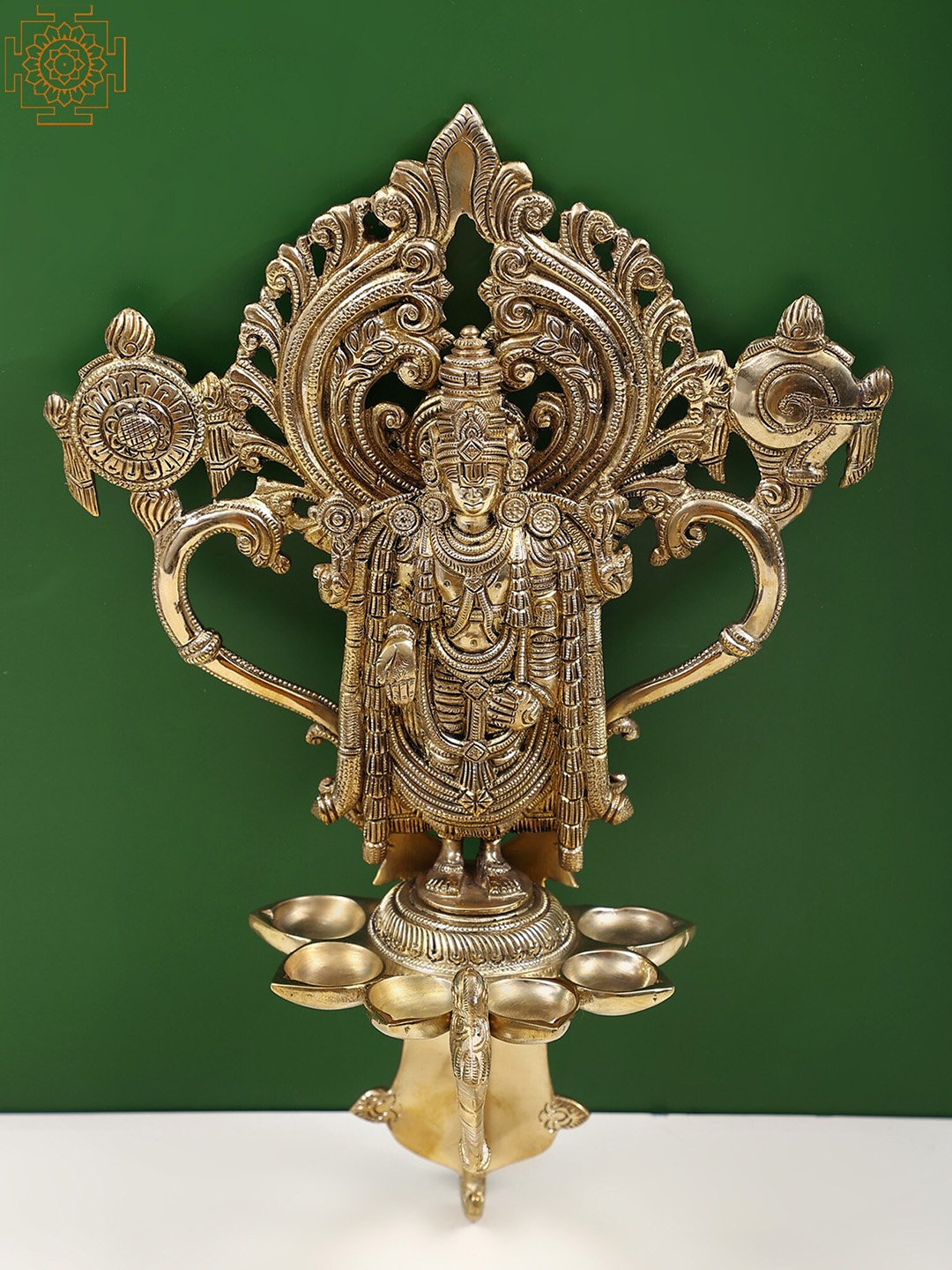 

Exotic India 13" Brass Tirupati Balaji Wall Hanging with Diya, Gold