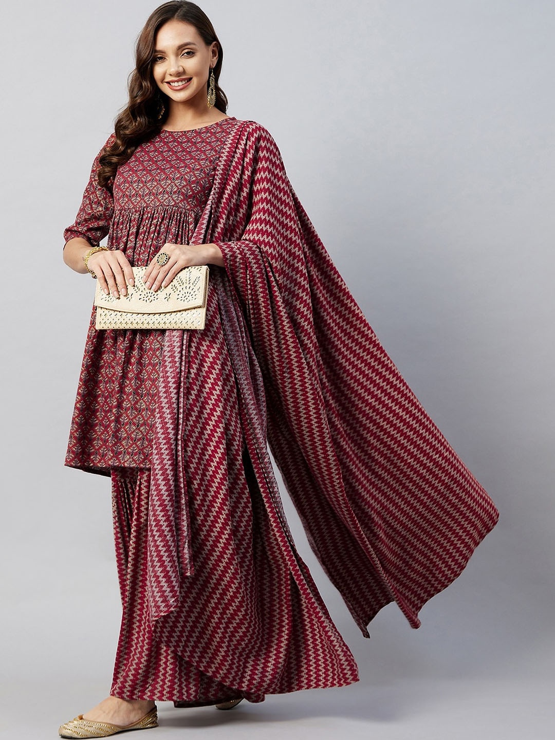 

InWeave Women Maroon Ethnic Motifs Printed Empire Kurta with Sharara & With Dupatta
