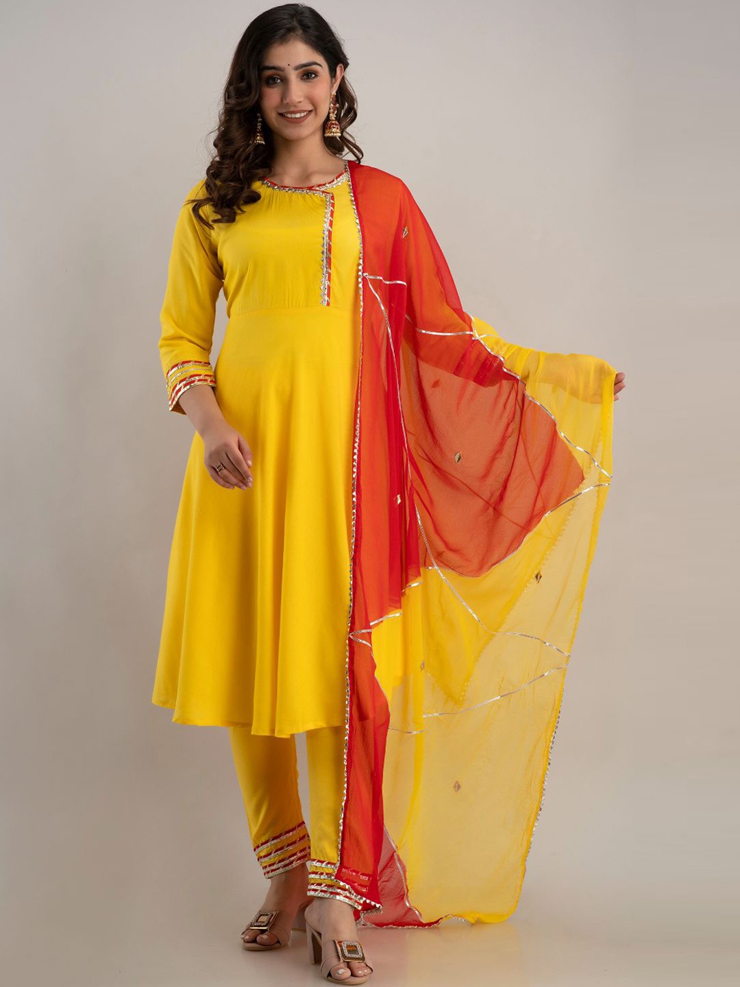 

Lovista Women Yellow Embroidered Empire Kurti With Churidar & Dupatta