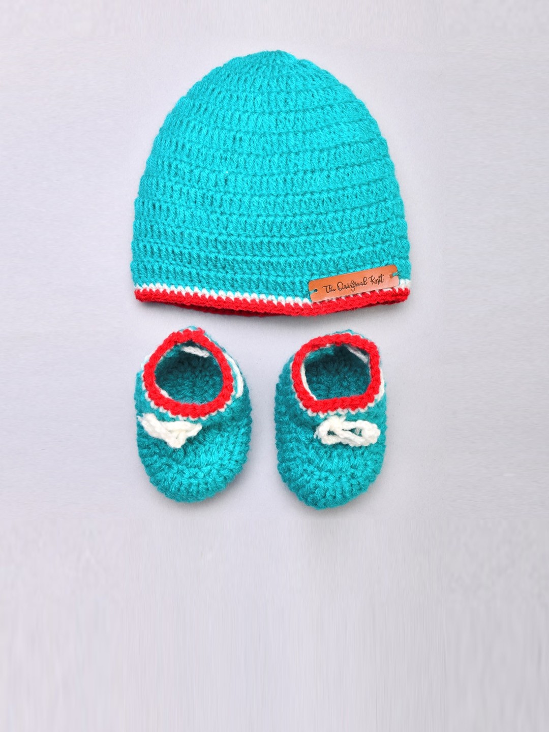 

The Original Knit Kids Pack Of 2 Turquoise Blue & Red Knitted Cap & Booties