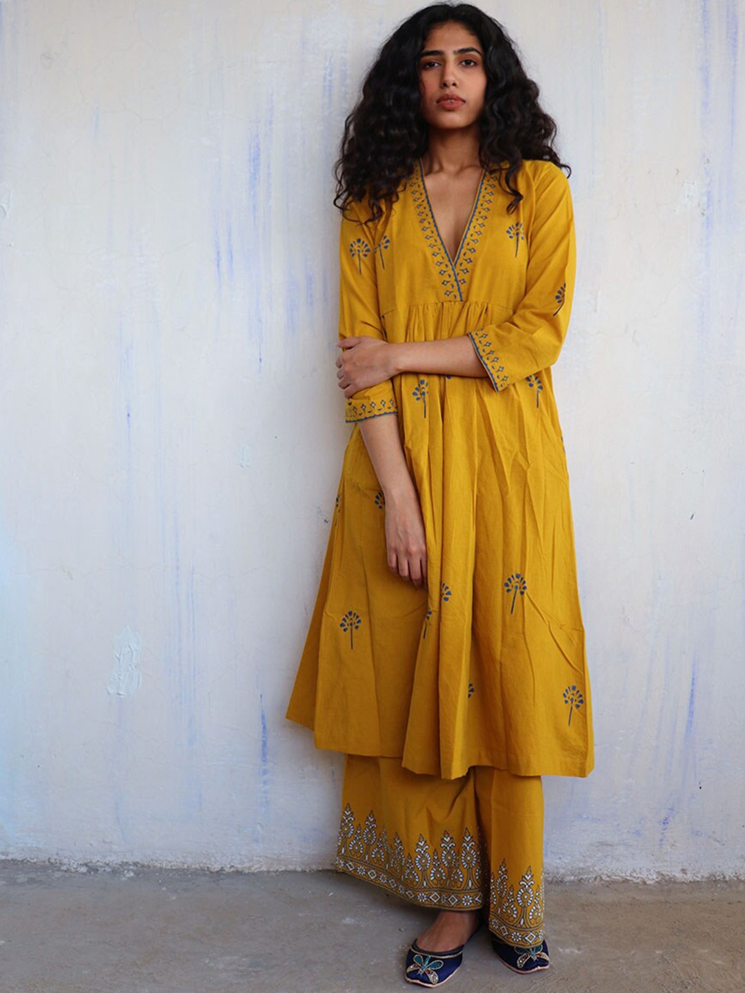 

Chidiyaa Women Mustard Yellow Embroidered Pleated Pure Cotton Kurti with Trousers