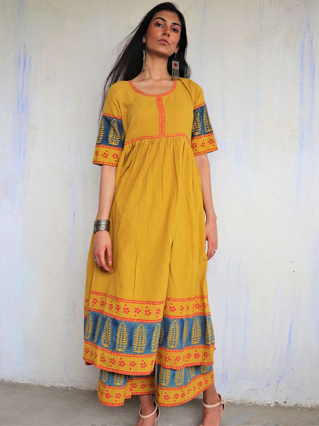 

Chidiyaa Women Mustard Yellow Ethnic Motifs Printed Pure Cotton Kurta with Palazzos