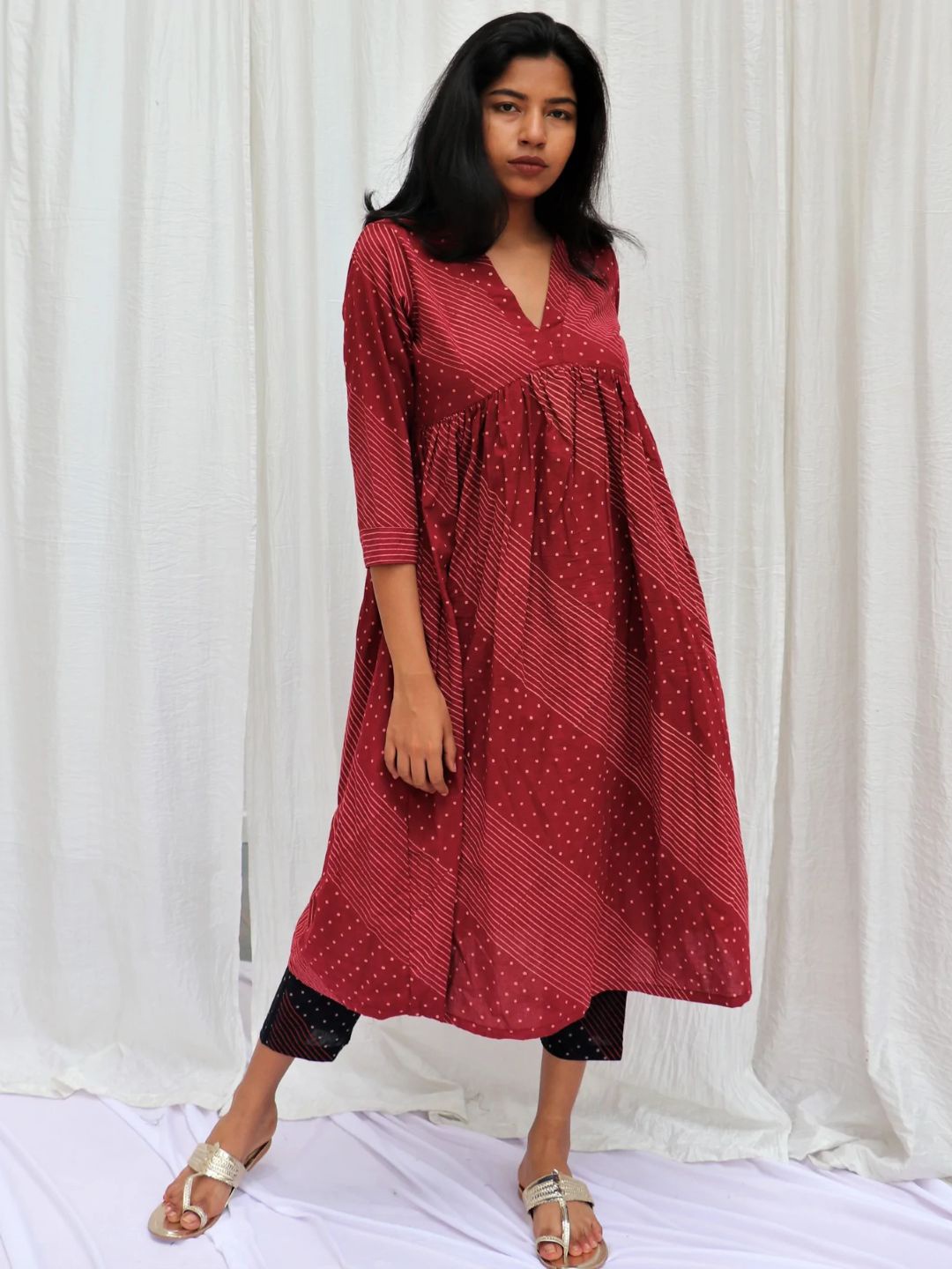 

Chidiyaa Women Maroon Striped Pleated Pure Cotton Kurti with Trousers