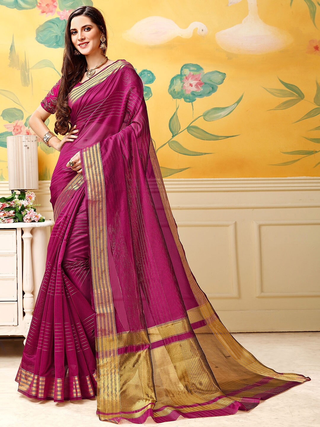 

Shaily Women Magenta & Gold-Toned Striped Zari Silk Blend Kanjeevaram Saree