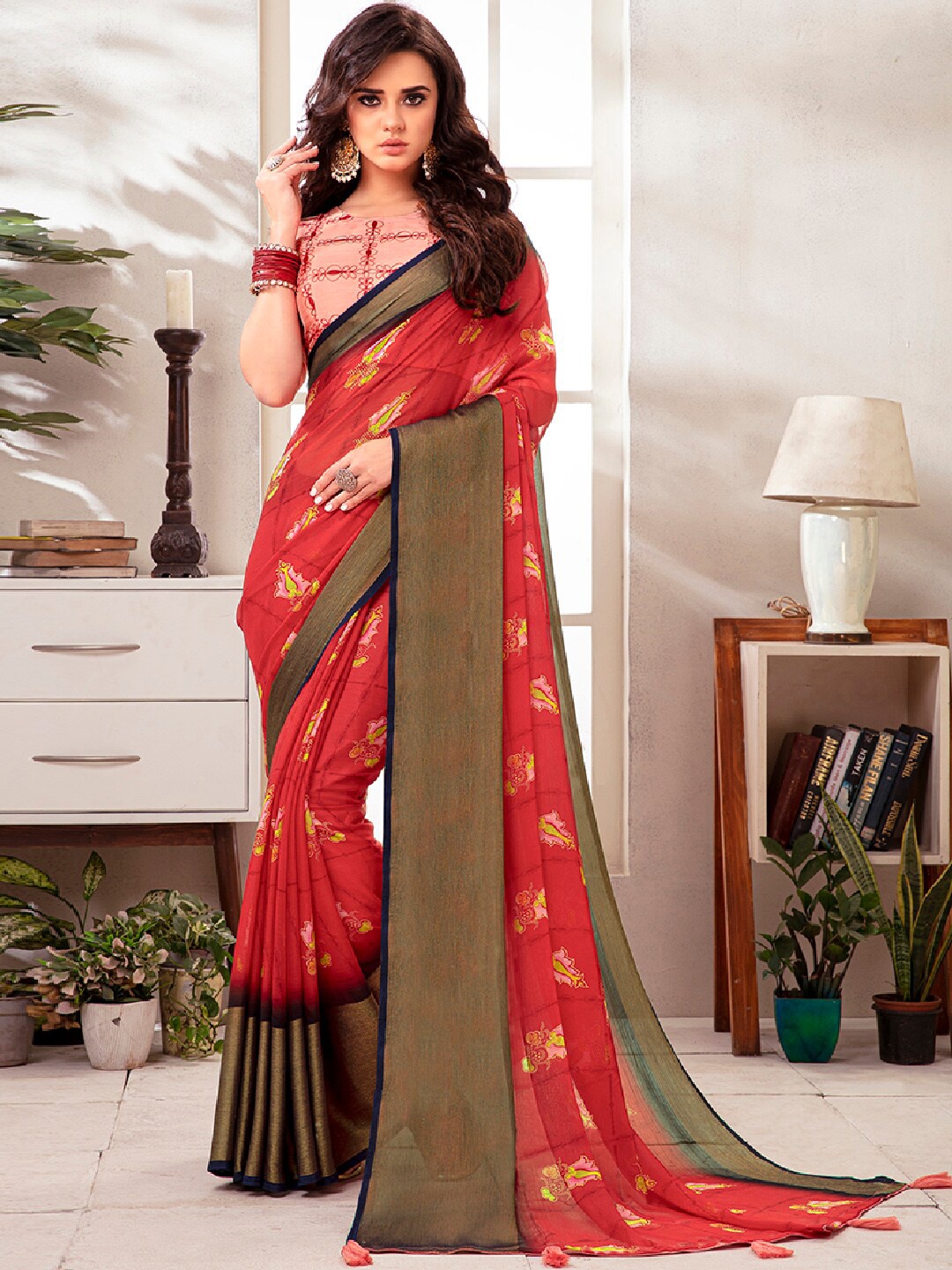 

Shaily Red & Pink Ethnic Motifs Poly Georgette Tassel Saree