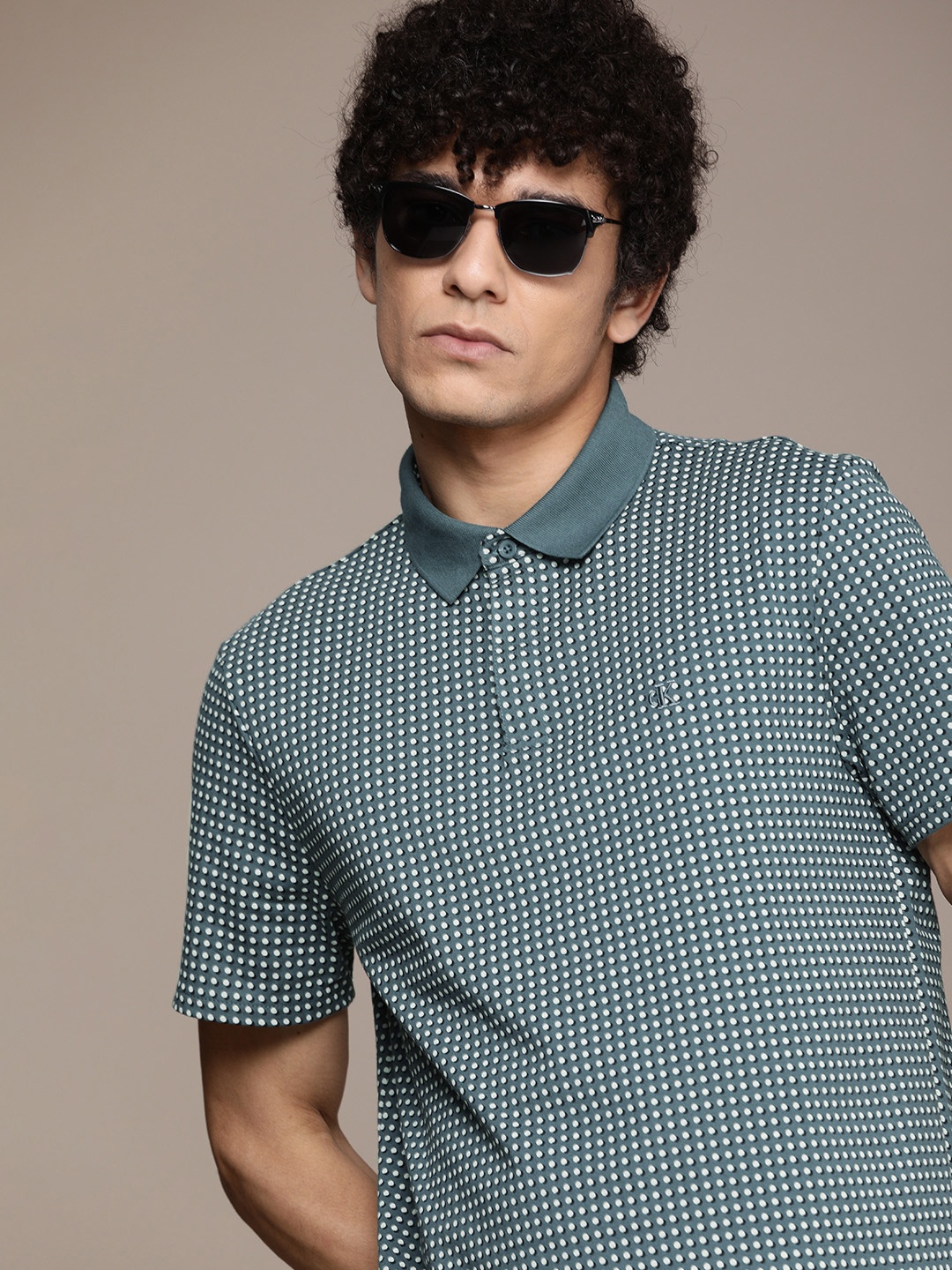 

Calvin Klein Jeans Men Teal Blue & White Polka Dot Printed Polo Collar T-shirt
