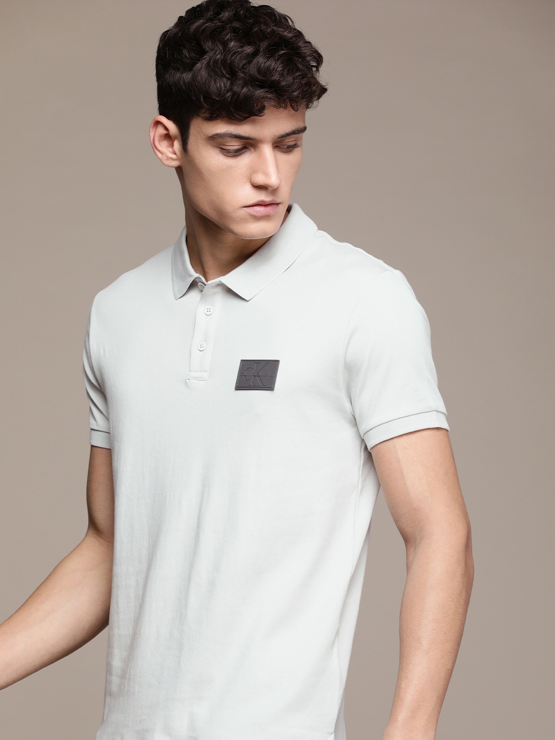 

Calvin Klein Jeans Men Grey Solid Polo Collar Brand Logo Applique Slim Fit T-shirt