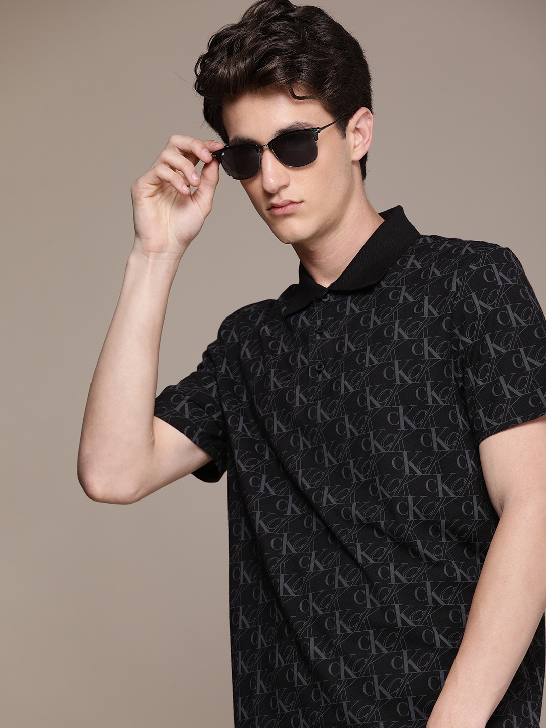 

Calvin Klein Jeans Men Black & Grey Typography Printed Polo Collar T-shirt