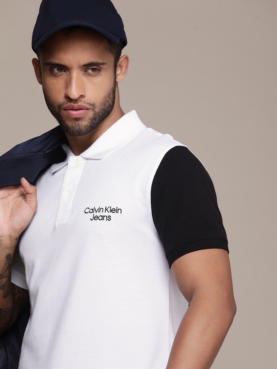 

Calvin Klein Jeans Men White & Black Colourblocked Polo Collar Pure Cotton T-shirt