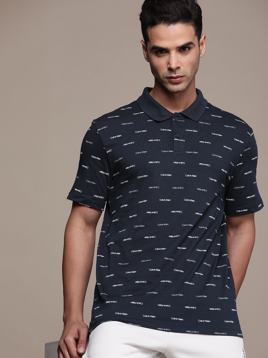 

Calvin Klein Jeans Men Navy Blue Brand Logo Printed Pure Cotton Polo Collar T-shirt