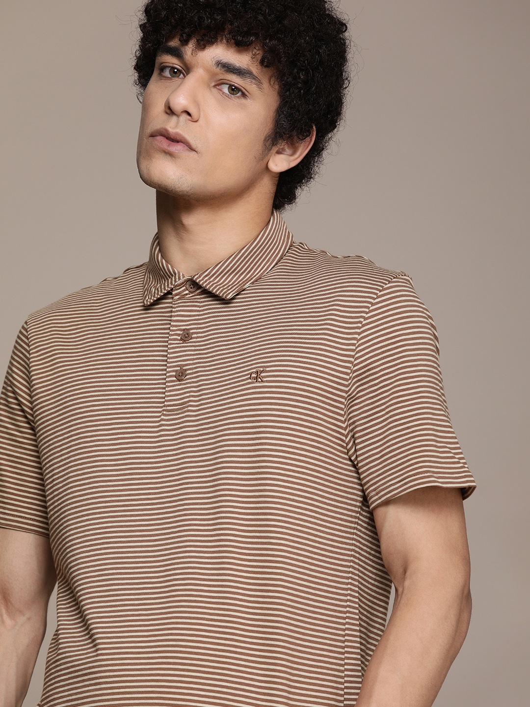 

Calvin Klein Jeans Men Brown & Off White Striped Polo Collar Pure Cotton T-shirt