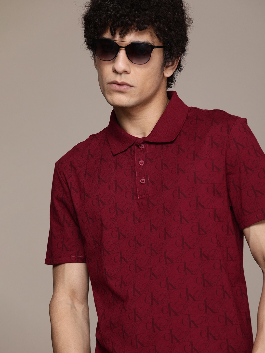 

Calvin Klein Jeans Men Maroon & Black Typography Printed Polo Collar T-shirt