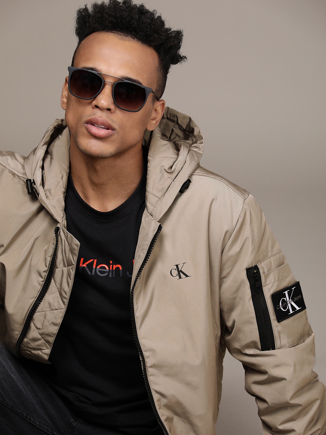 

Calvin Klein Jeans Men Beige Brand Logo Printed Hooded Bomber Jacket