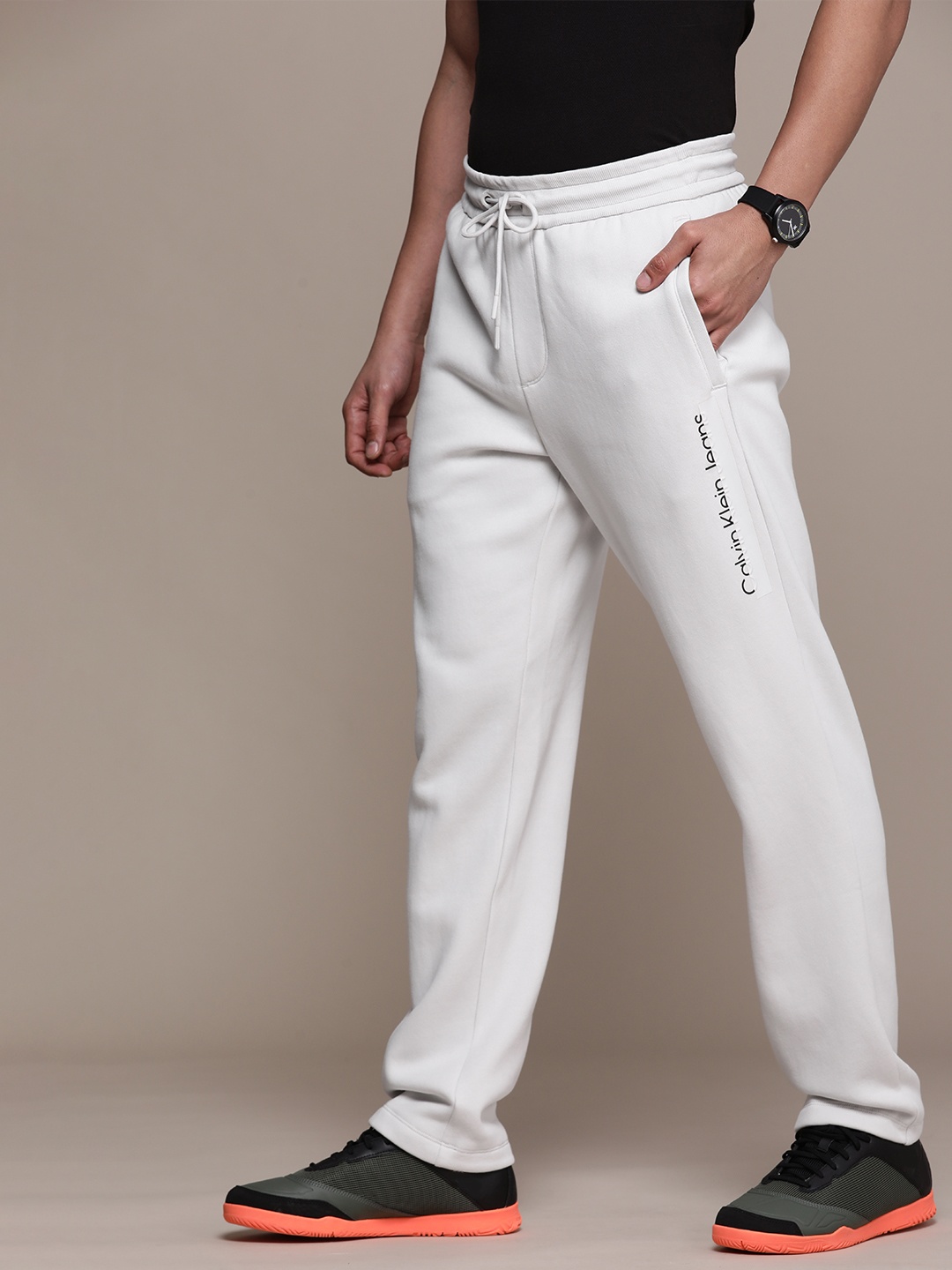 

Calvin Klein Jeans Men White Solid Track Pants with Brand Logo Detail & Draw cords Closure