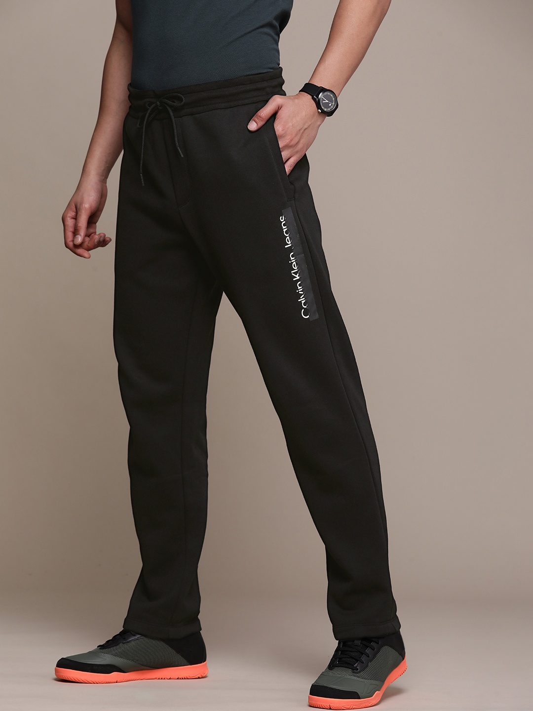 

Calvin Klein Jeans Men Black Solid Track Pants with Logo Print Detailing