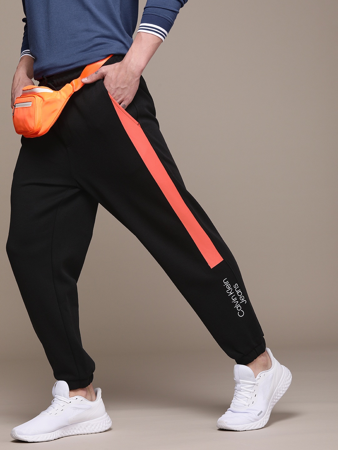 

Calvin Klein Jeans Black Brand Logo Printed Mid Rise Joggers With Constrast Side Stripes