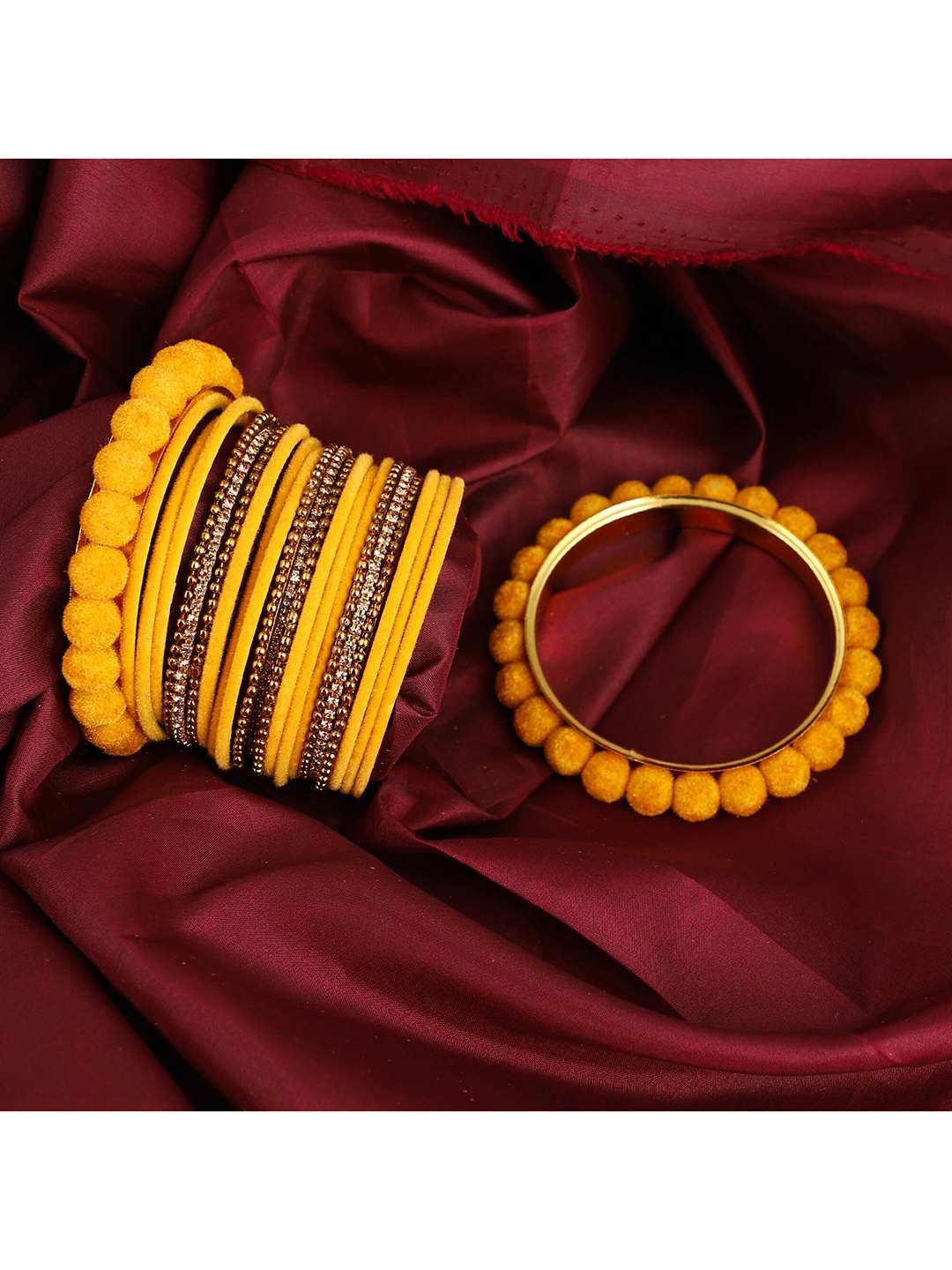 

ZaffreCollections Set Of 23 Gold-Plated Yellow Velvet Coated & Stone Studded Metal Bangles