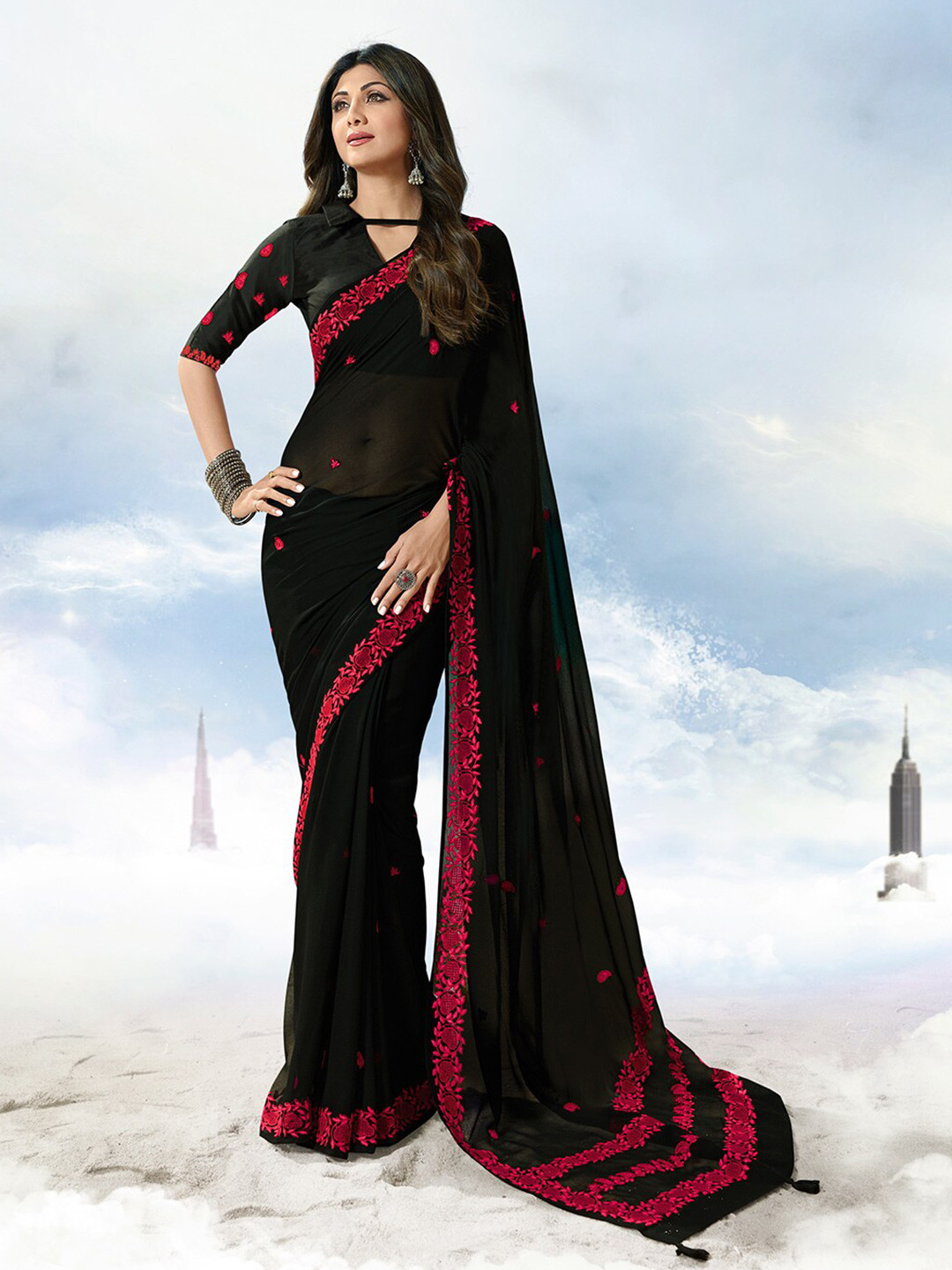 

Shaily Women Black & Magenta Embroidered Pure Georgette Saree