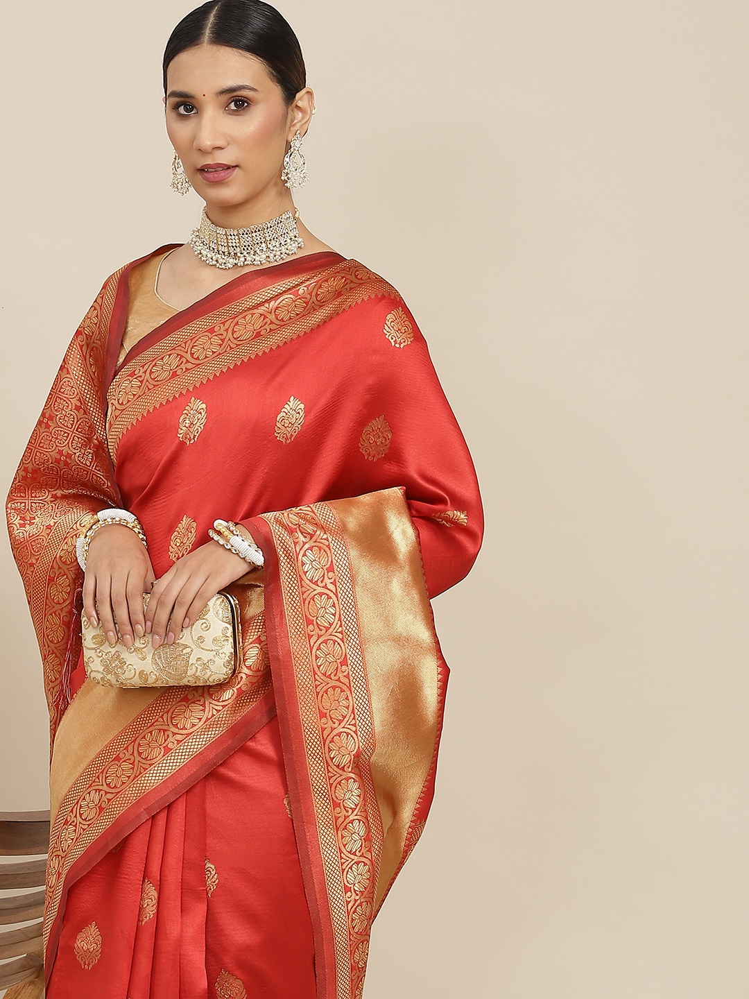 

Ishin Rust Orange & Golden Ethnic Motifs Zari Banarasi Saree