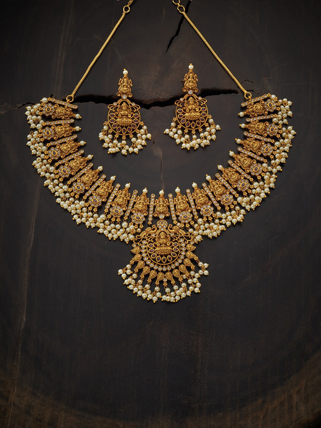 

Kushal's Fashion Jewellery Gold-Toned Red Ruby Stone-Studded & Beaded Jewellery Set
