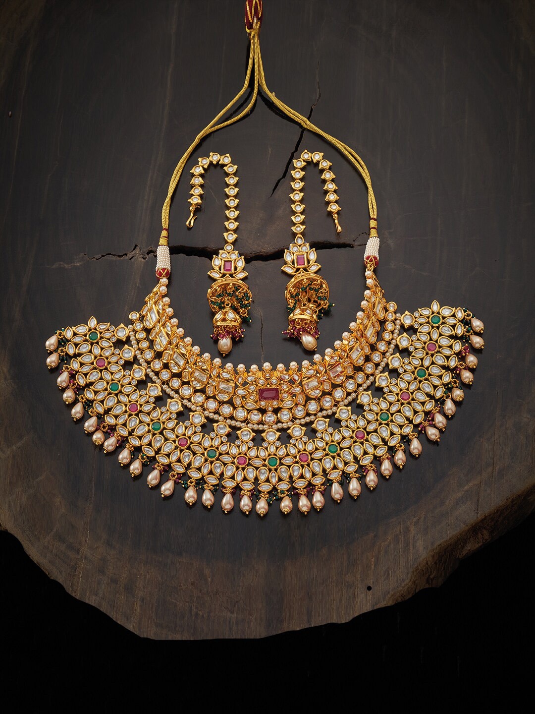 

Kushal's Fashion Jewellery Gold-Toned Green & Red Kundan-Studded & Beaded Bridal Jewellery Set